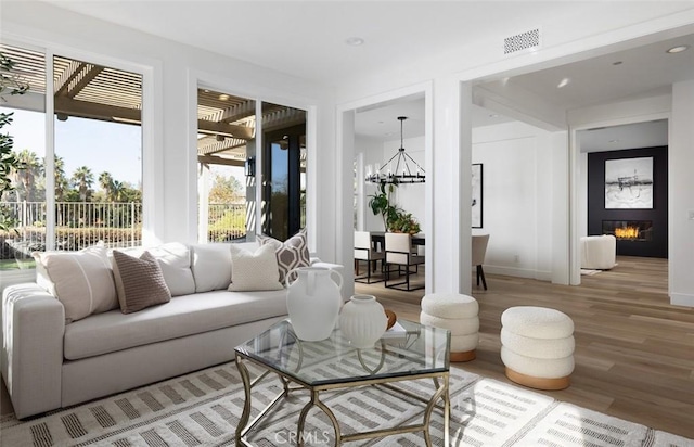 sunroom featuring a chandelier