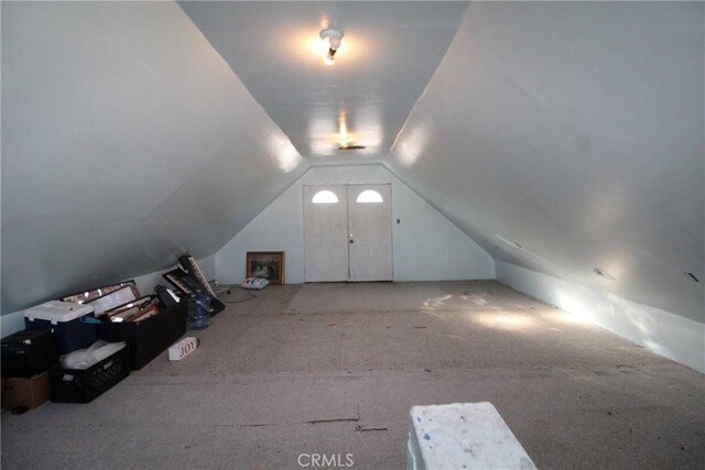 additional living space featuring vaulted ceiling