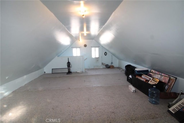 additional living space featuring vaulted ceiling