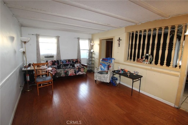 living room featuring hardwood / wood-style floors and beamed ceiling