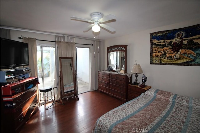 bedroom featuring dark hardwood / wood-style flooring, access to outside, and ceiling fan