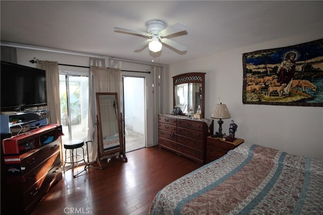 bedroom featuring access to outside, a ceiling fan, and dark wood-style flooring