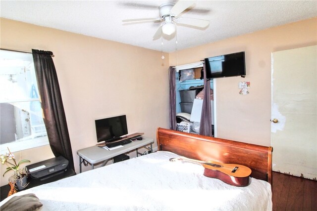 bedroom with hardwood / wood-style flooring and ceiling fan