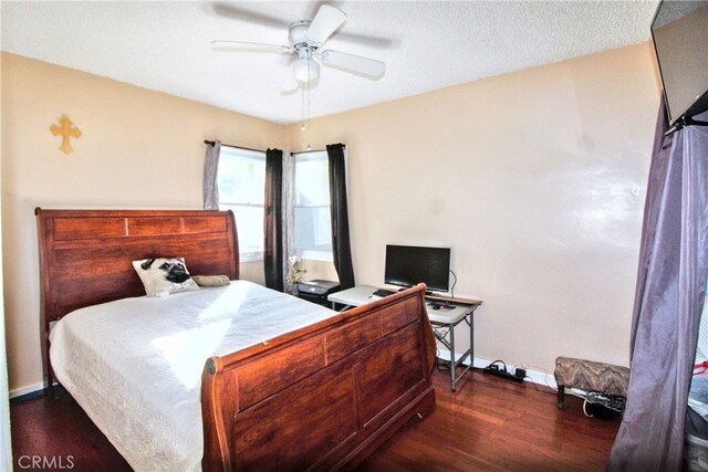 bedroom with dark wood-type flooring and ceiling fan