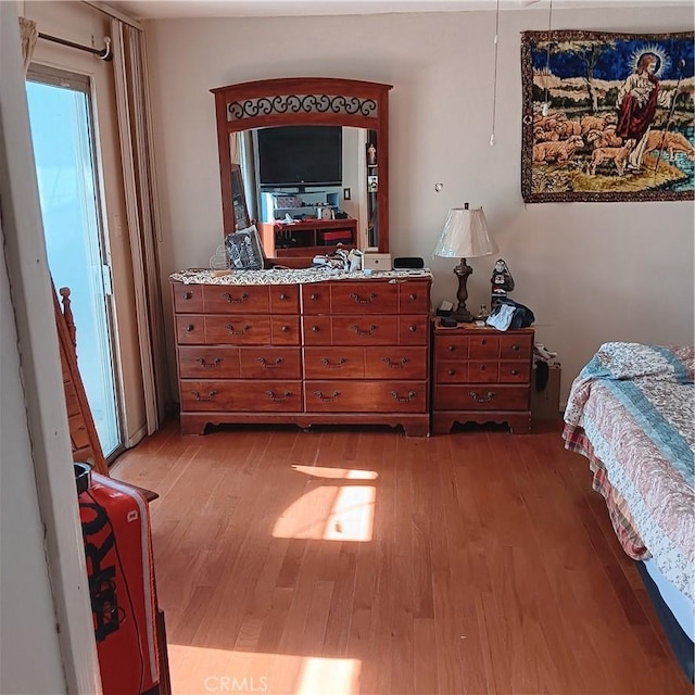 bedroom featuring light wood-type flooring