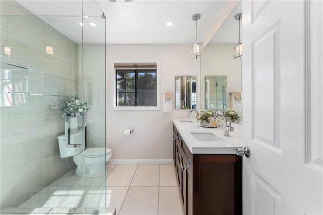 13056 Burns Ln, Redlands, CA 92373 - bathroom featuring toilet, double vanity, tile patterned floors, baseboards, and recessed lighting