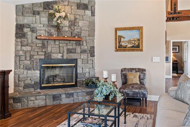 13056 Burns Ln, Redlands, CA 92373 - living area with wood finished floors, baseboards, and a fireplace