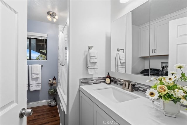 bathroom featuring vanity and hardwood / wood-style floors