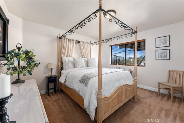 bedroom with dark colored carpet