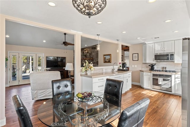 13056 Burns Ln, Redlands, CA 92373 - dining space with lofted ceiling, light wood-style flooring, recessed lighting, ceiling fan, and baseboards