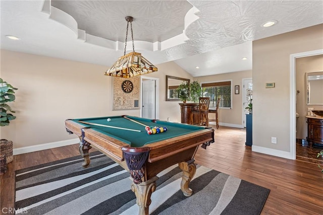 rec room with hardwood / wood-style flooring, a raised ceiling, pool table, and a textured ceiling