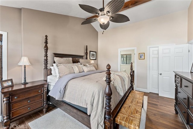 bedroom featuring lofted ceiling, dark hardwood / wood-style floors, and ceiling fan