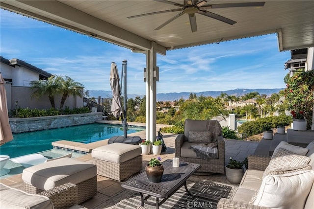 13056 Burns Ln, Redlands, CA 92373 - fenced backyard with a ceiling fan, a mountain view, a patio, an outdoor living space, and an outdoor pool