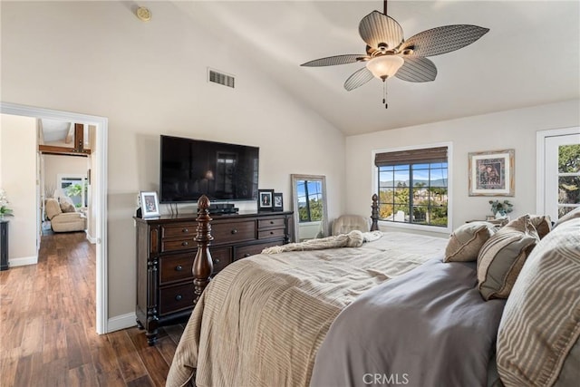 bedroom featuring ceiling fan, dark hardwood / wood-style flooring, and high vaulted ceiling