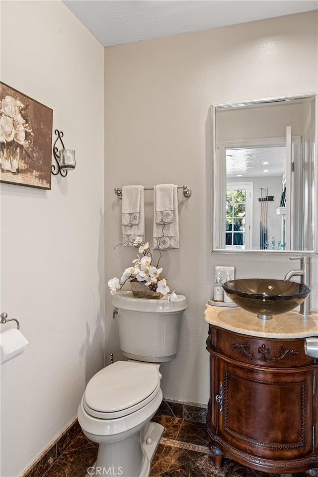 bathroom with vanity and toilet