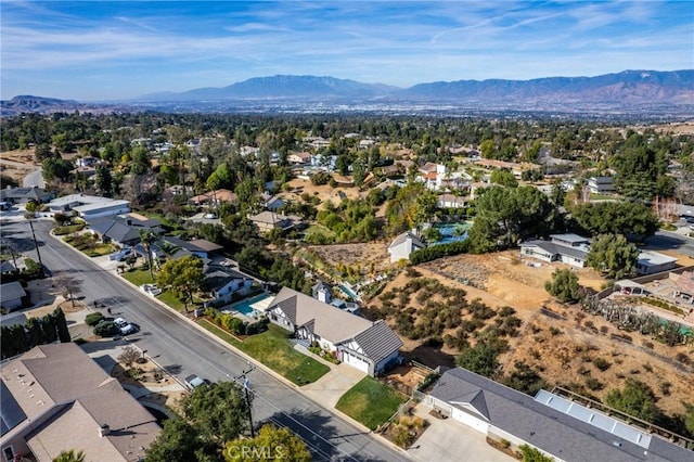 birds eye view of property with a mountain view