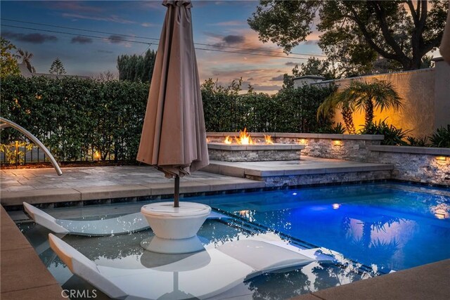 13056 Burns Ln, Redlands, CA 92373 - view of swimming pool with an outdoor fire pit and a patio area