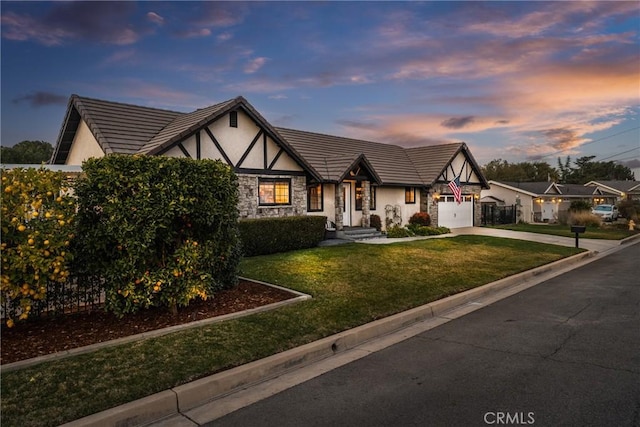 13056 Burns Ln, Redlands, CA 92373 - english style home with stone siding, stucco siding, an attached garage, concrete driveway, and a front yard