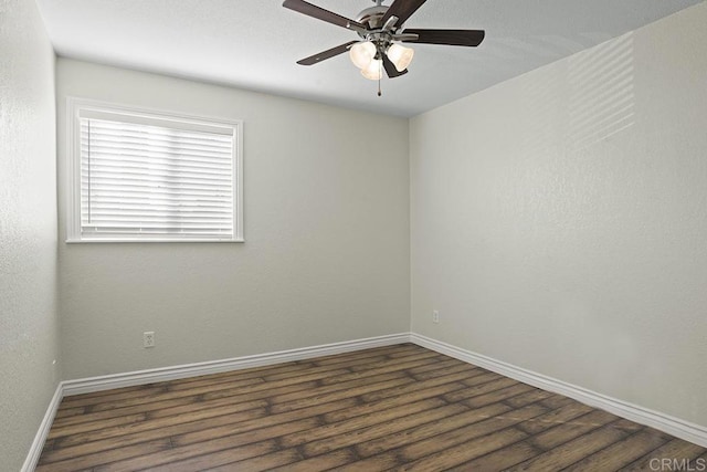 empty room featuring dark hardwood / wood-style floors and ceiling fan