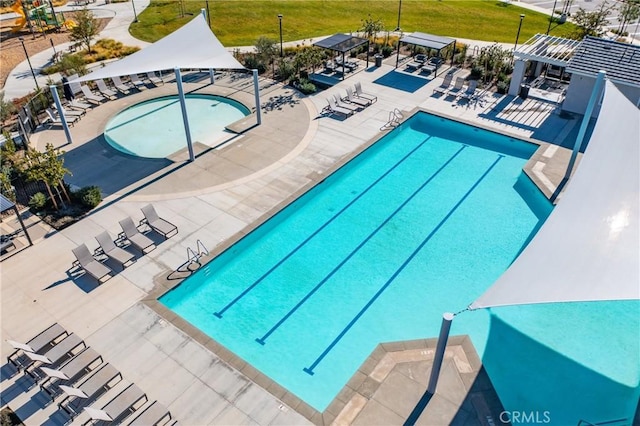 view of swimming pool featuring a patio and a pergola