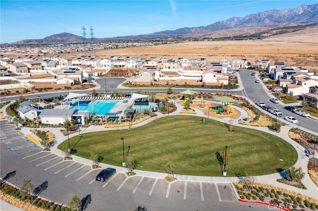 birds eye view of property featuring a mountain view