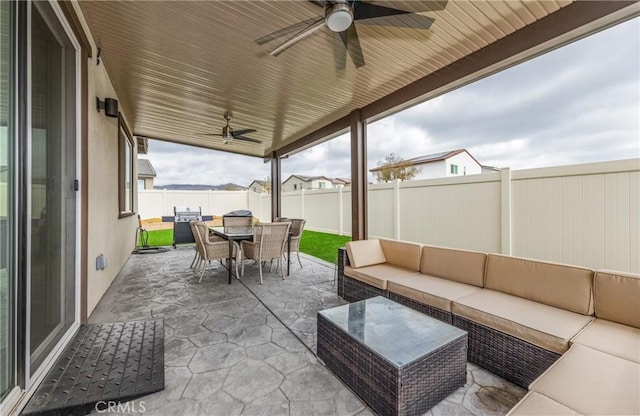 view of patio / terrace with ceiling fan and outdoor lounge area