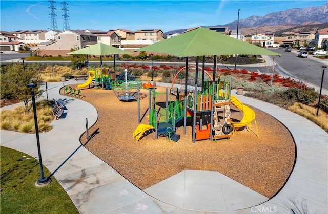 view of playground featuring a mountain view