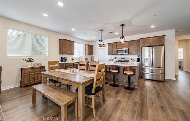 dining space featuring dark wood-type flooring