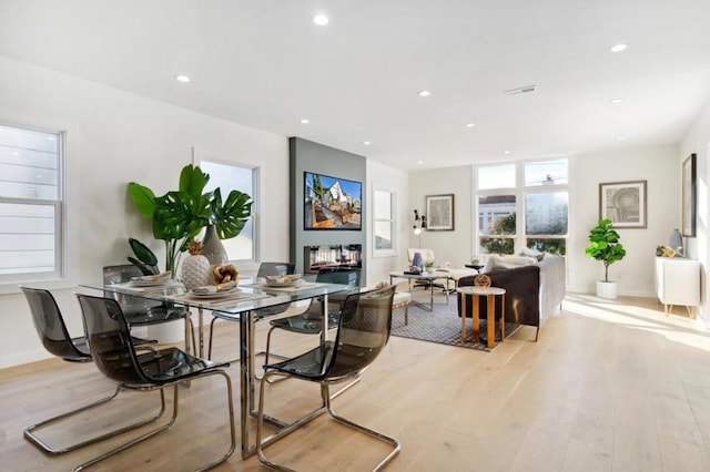 dining space featuring light wood-type flooring