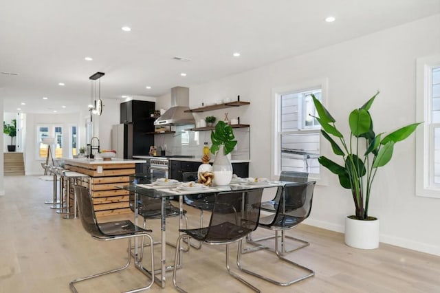 dining room featuring light hardwood / wood-style flooring