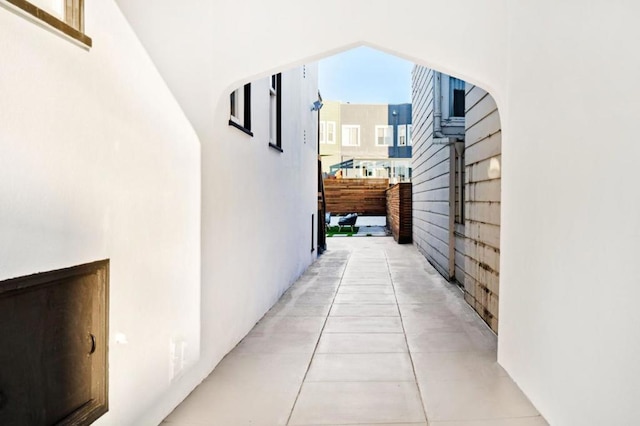 hallway featuring light tile patterned floors