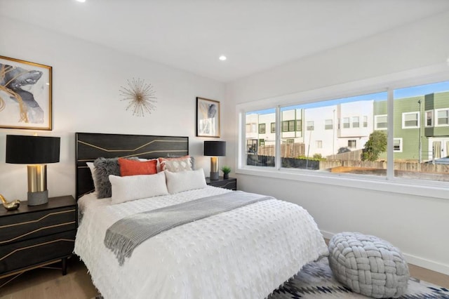 bedroom with hardwood / wood-style flooring