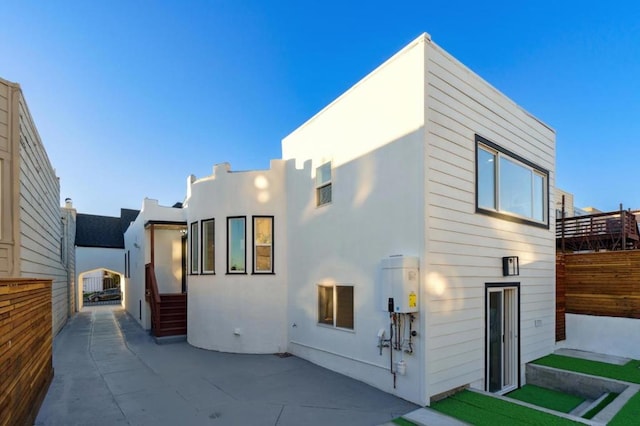 back of house with a patio