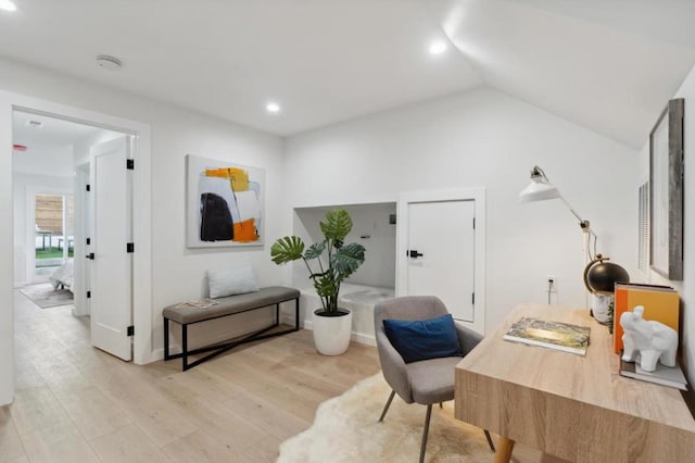 office area with lofted ceiling and light wood-type flooring