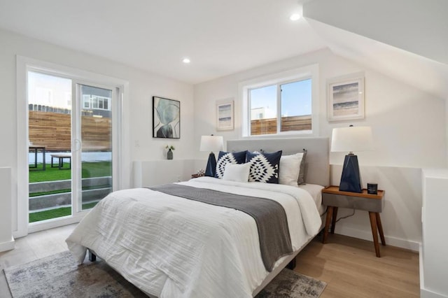 bedroom with light hardwood / wood-style flooring and access to outside