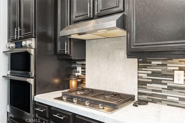 kitchen featuring tasteful backsplash and stainless steel appliances