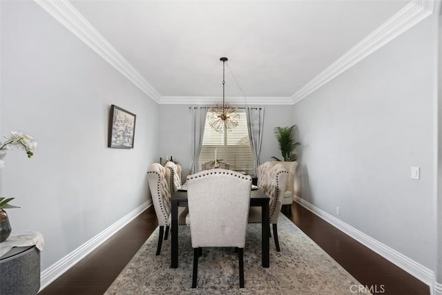 dining space with ornamental molding and wood-type flooring