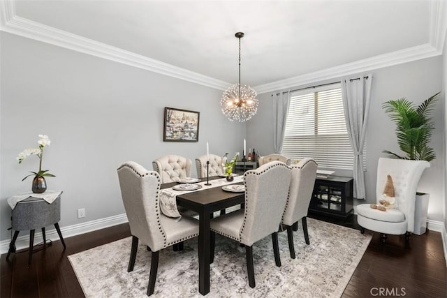 dining space with ornamental molding, dark hardwood / wood-style floors, and a chandelier