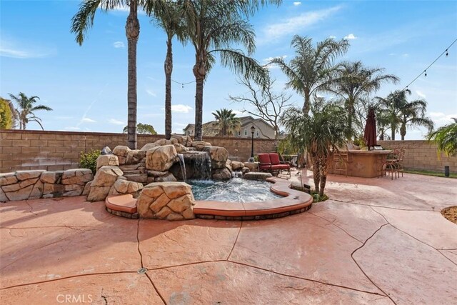 view of patio featuring exterior bar