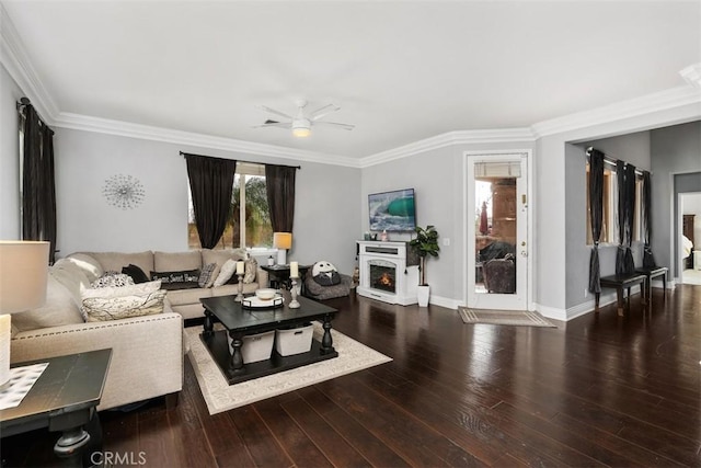 living room with crown molding, hardwood / wood-style floors, and ceiling fan