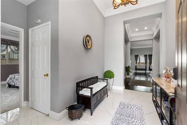 hallway featuring an inviting chandelier and crown molding