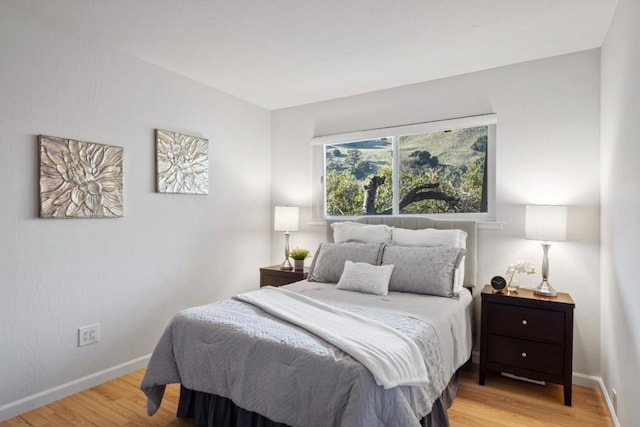 bedroom with light wood-type flooring