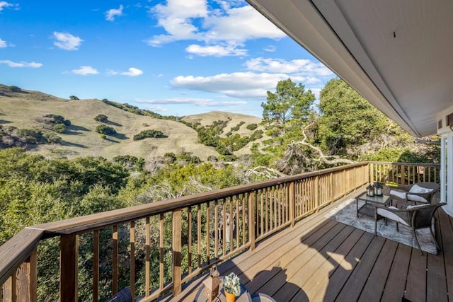 wooden terrace with a mountain view