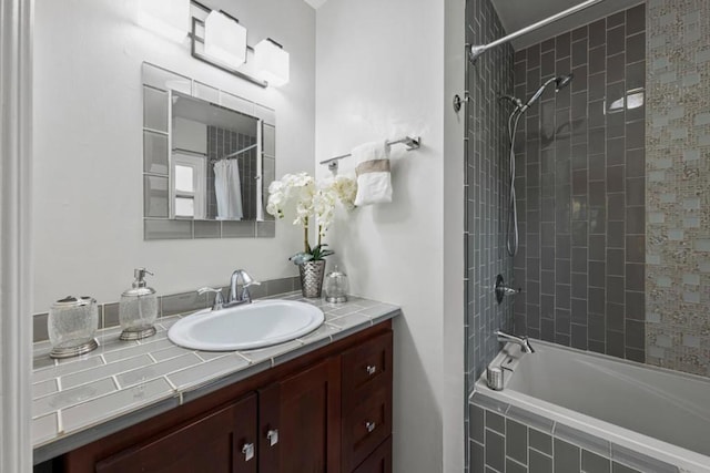 bathroom featuring vanity and shower / bathtub combination with curtain