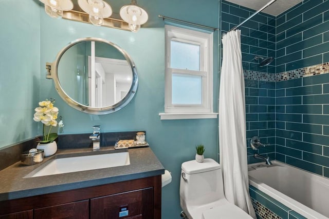 full bathroom featuring vanity, toilet, and shower / bath combo