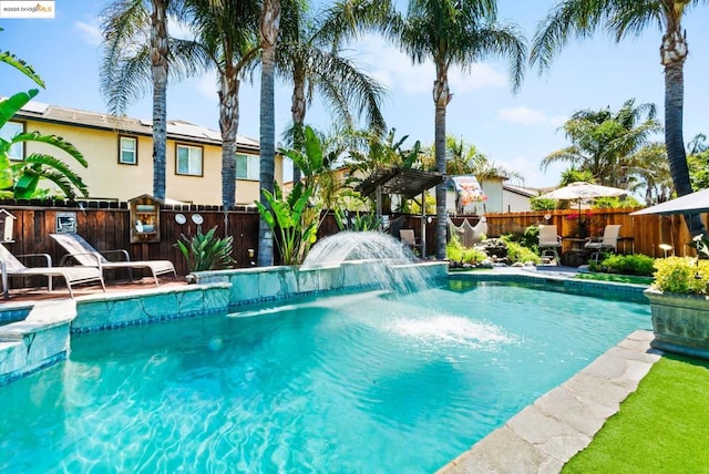 view of pool featuring pool water feature and a pergola