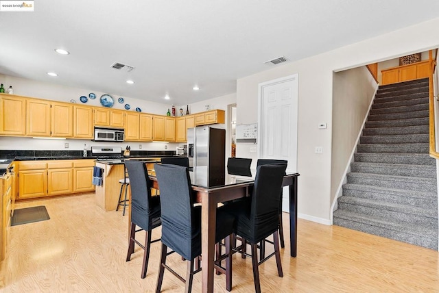 dining space featuring light hardwood / wood-style flooring