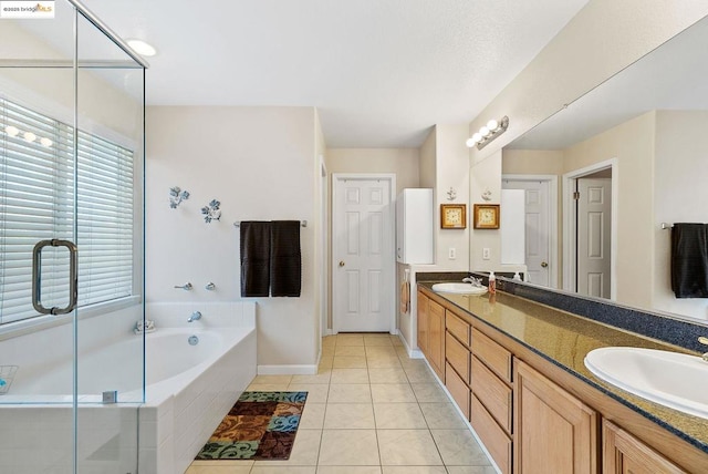 bathroom featuring vanity, tile patterned floors, and plus walk in shower