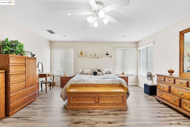 bedroom with ceiling fan and light hardwood / wood-style flooring