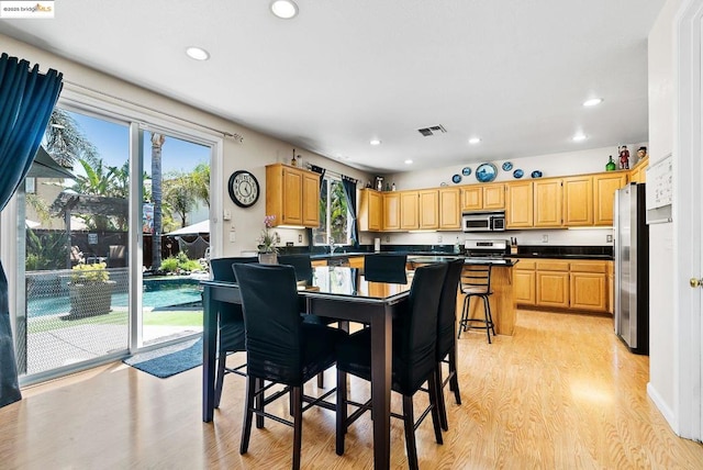 dining room with light hardwood / wood-style floors